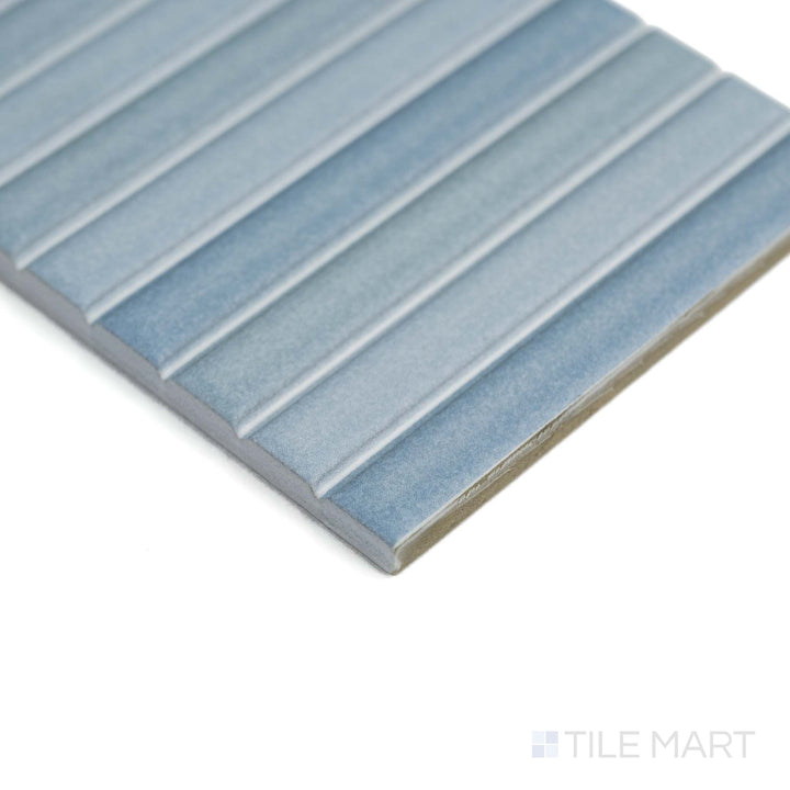 Roku Blue 4.5X9 matte porcelain is shown from a corner, highlighting its cool tone and refined surface finish.