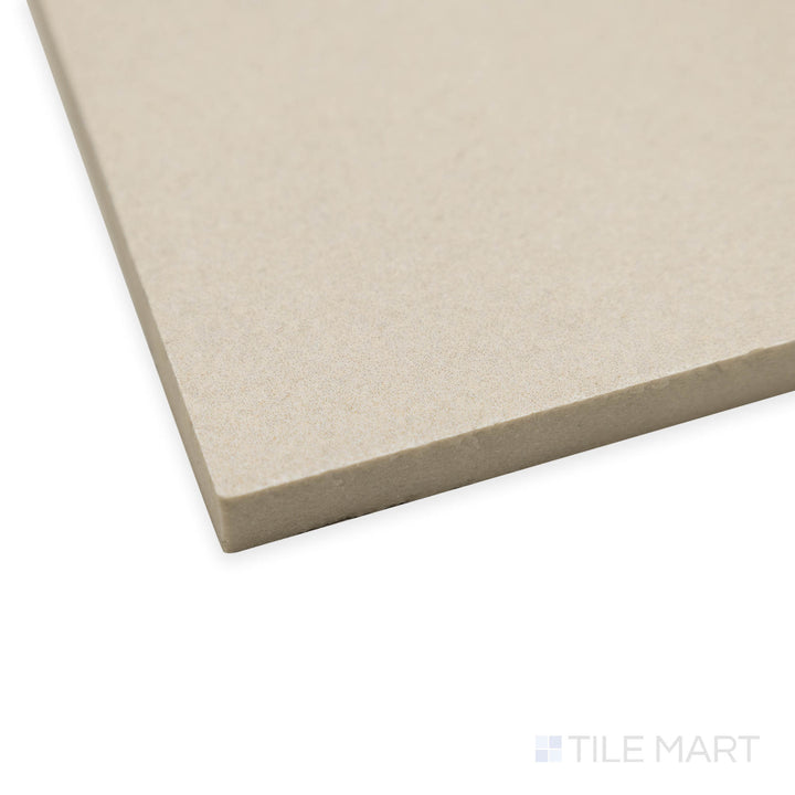 Side-angle view of Boost Balance Ivory 48x48 matte porcelain tile, highlighting its soft ivory shade, refined matte finish, and precision-cut edges that form a smooth intersection.