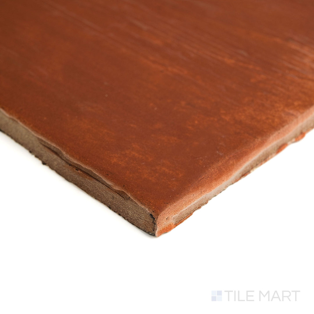 Angled corner shot of Fuego Teja 18x18 matte porcelain tile highlighting its warm terracotta tone, natural matte texture, and crisp cut along the tile edge.