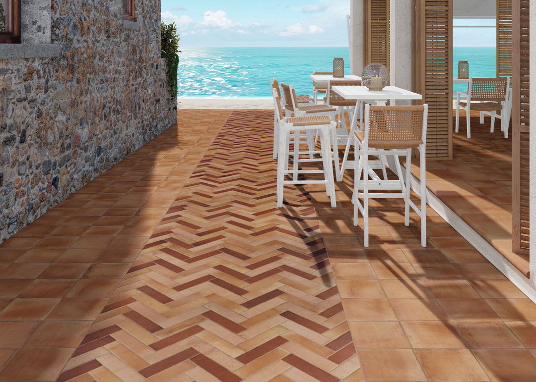 Installed view of Fuego Antic 9x9 matte porcelain tile, showcasing its time-worn texture, earthy hues, and vintage-inspired appearance.