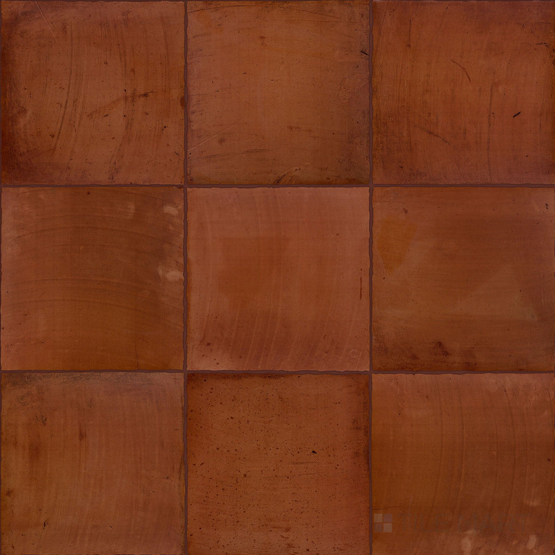 Fuego Teja 9x9 matte porcelain tiles displayed in a group layout, emphasizing warm clay-like tones and the textured, matte surface variation.