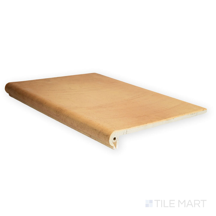 Seen from above, the Fuego Antic Stair Coping 13x18 matte porcelain tile showcases its full profile with aged stone coloring and rounded edge finish.