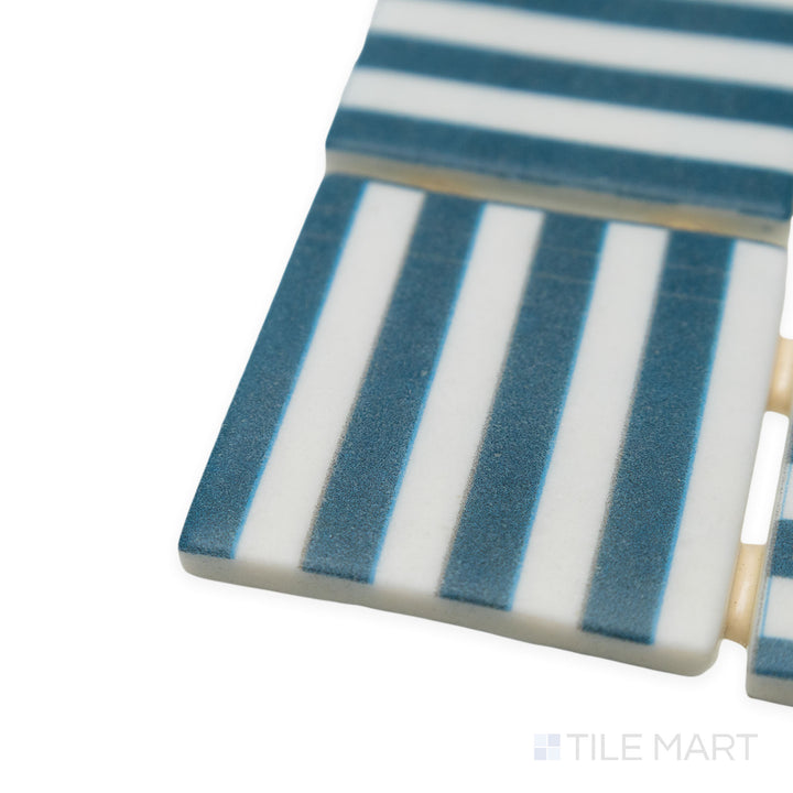 Corner shot of Onix Glass Icon Navy Blue 2" square Bidart matte mosaic, showcasing its deep blue hue, crisp edges, and smooth matte surface that subtly diffuses light.