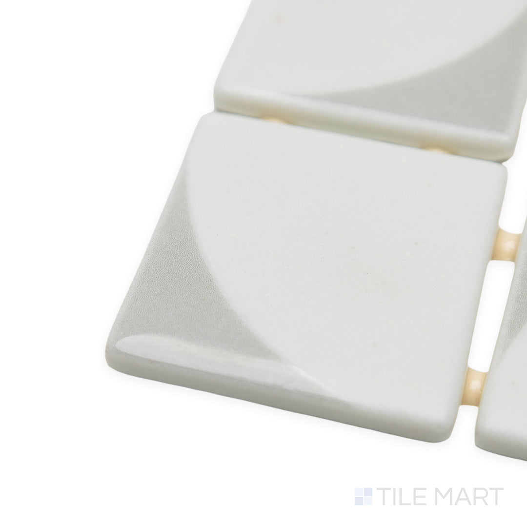 Close-up corner shot of Onix Glass Icon Light Grey 2" square Memphis matte mosaic, drawing attention to its neutral grey shade, defined corners, and soft, uniform texture.