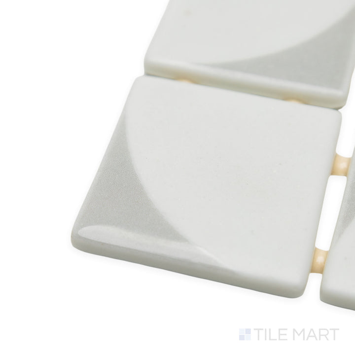 Close-up corner shot of Onix Glass Icon Light Grey 2" square Memphis matte mosaic, drawing attention to its neutral grey shade, defined corners, and soft, uniform texture.