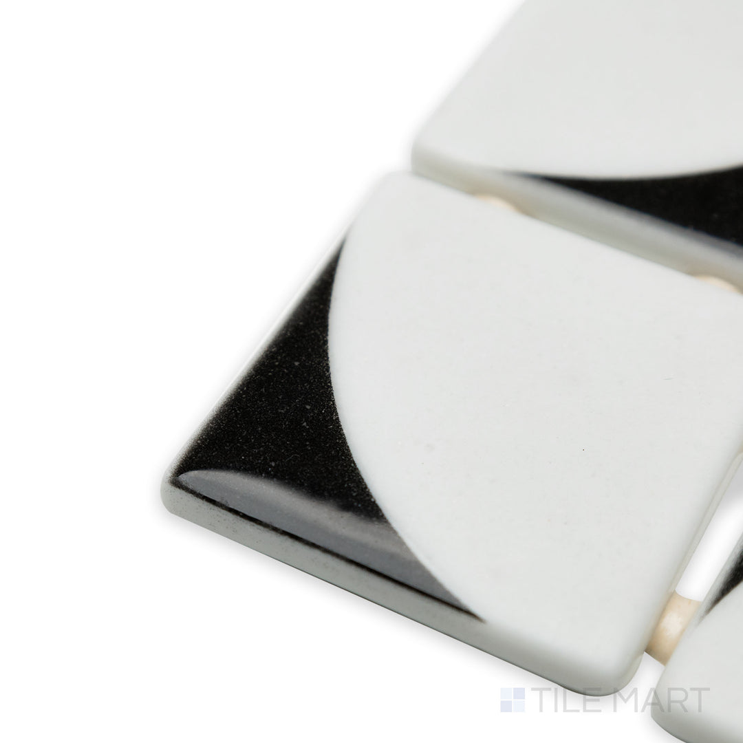 Angled corner shot of Onix Glass Icon Black 2" square Memphis matte mosaic, emphasizing its bold black color, sleek matte finish, and sharp, structured corners.