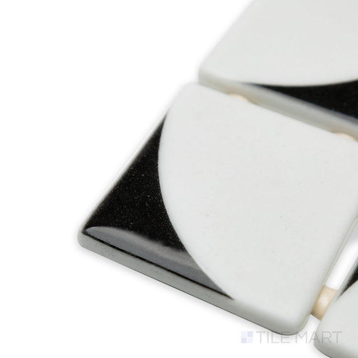 Angled corner shot of Onix Glass Icon Black 2" square Memphis matte mosaic, emphasizing its bold black color, sleek matte finish, and sharp, structured corners.