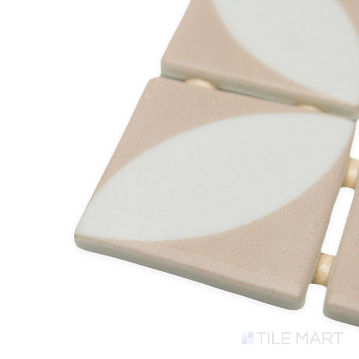 Angled close-up of Onix Glass Icon Pink 2" square Azalea matte mosaic, highlighting its delicate pink tone, clean lines, and the way its edges create a structured transition.