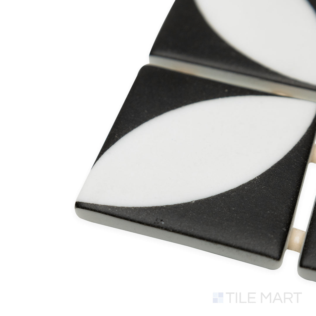 Angled perspective of Onix Glass Icon Black 2" square Azalea matte mosaic, drawing attention to its bold black tone, sharp edges, and fine matte detailing.
