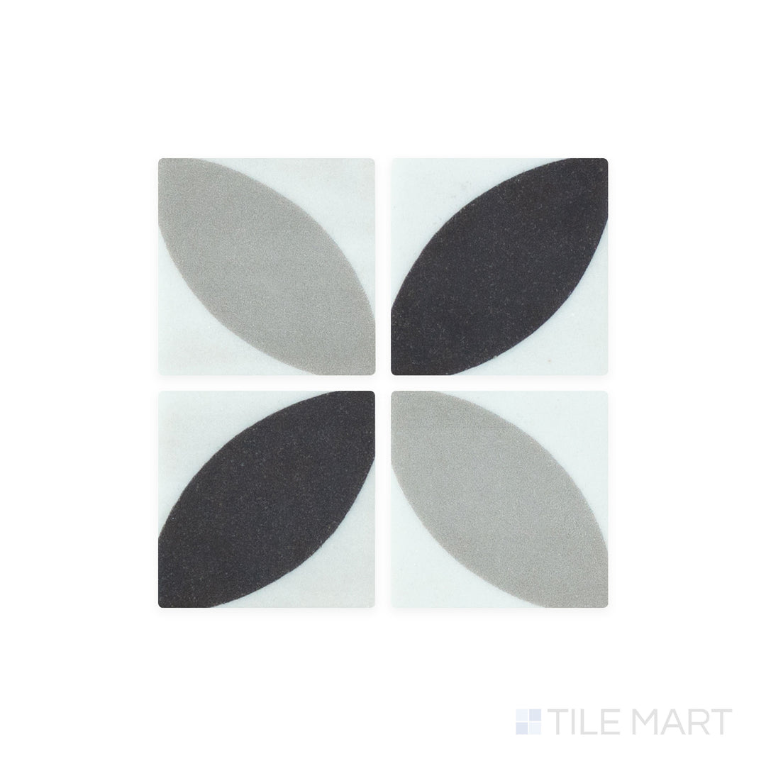 A close-up shot of Onix Glass - Icon Black 2" Square Dahlia Matte Mosaic tile highlights its dark, matte finish with a refined, understated texture for modern interiors.