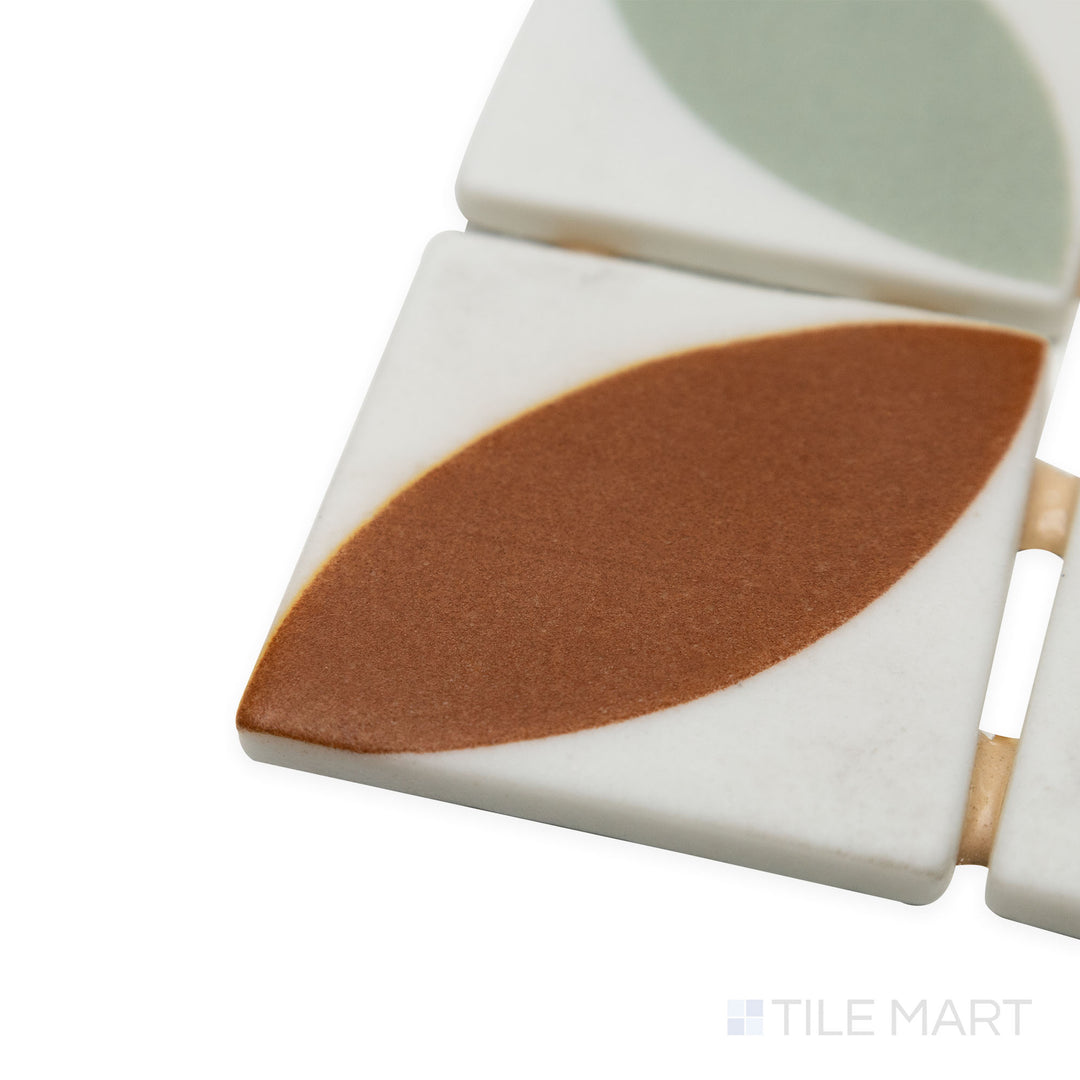 Corner shot of Onix Glass Icon Orange 2" square Dahlia matte mosaic, focusing on its warm, vibrant hue, defined corners, and a velvety matte texture.