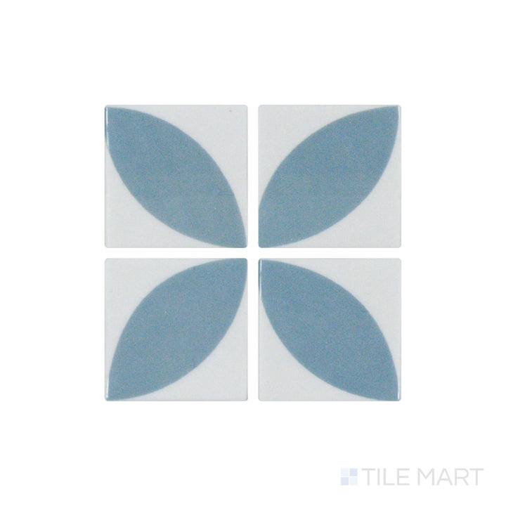 A close-up shot of Onix Glass - Icon Blue 2" Square Dahlia Matte, Gloss Mosaic tile highlights its smooth gloss surface contrasted with soft matte tones, adding depth and dimension.