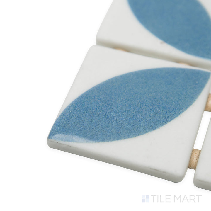 Side-angle close-up of Onix Glass Icon Blue 2" square Dahlia matte gloss mosaic, featuring a striking blue shade, glossy surface reflection, and precision-cut corners.