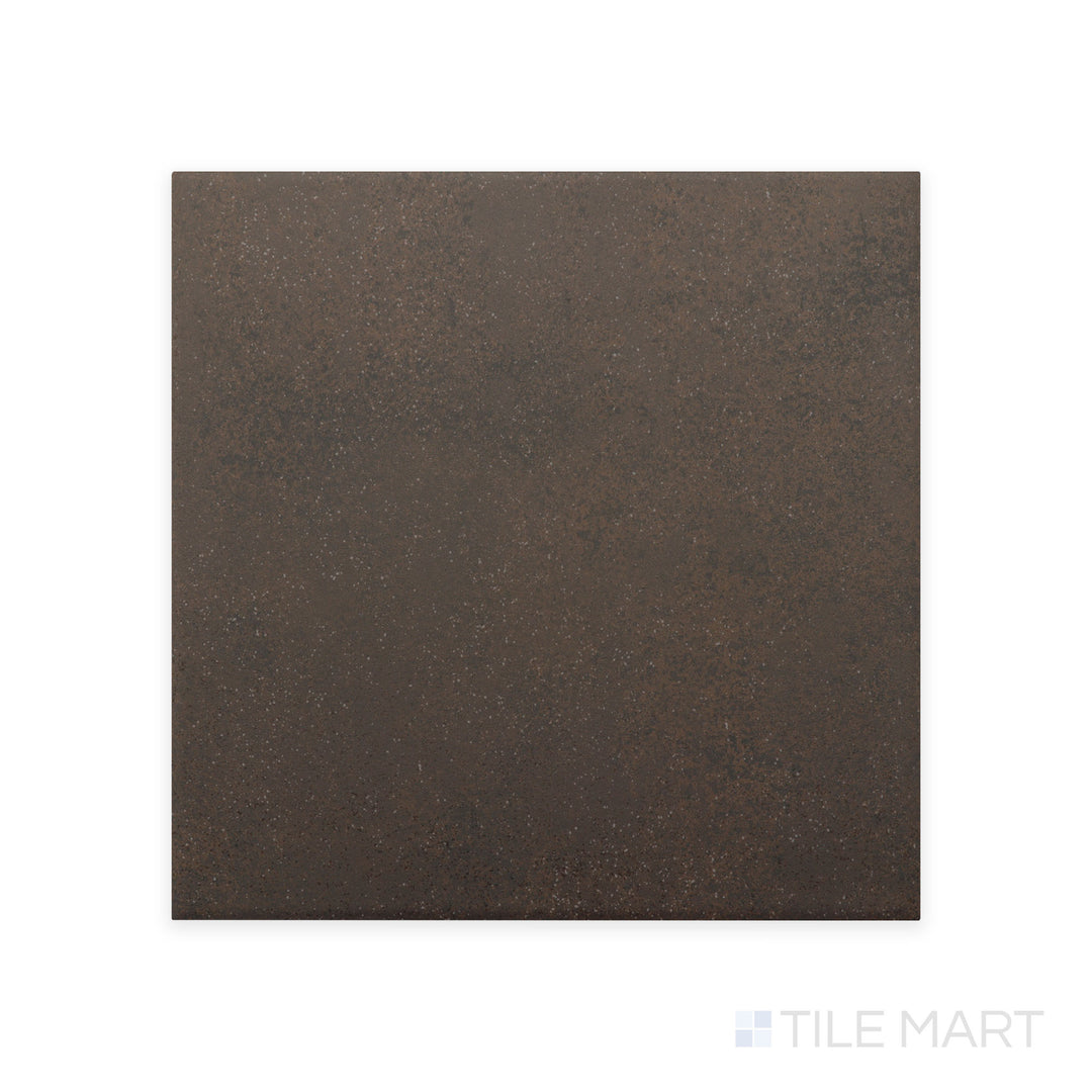 A close-up shot of Stage Brown 4X4 matte porcelain tile highlights its warm brown hue and smooth matte texture, creating a natural and earthy aesthetic.