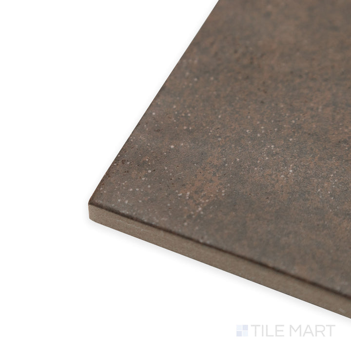 Corner shot of Stage Brown 4x4 matte porcelain tile, showcasing its warm earthy tone, subtle texture, and clean-cut edges forming a precise intersection.