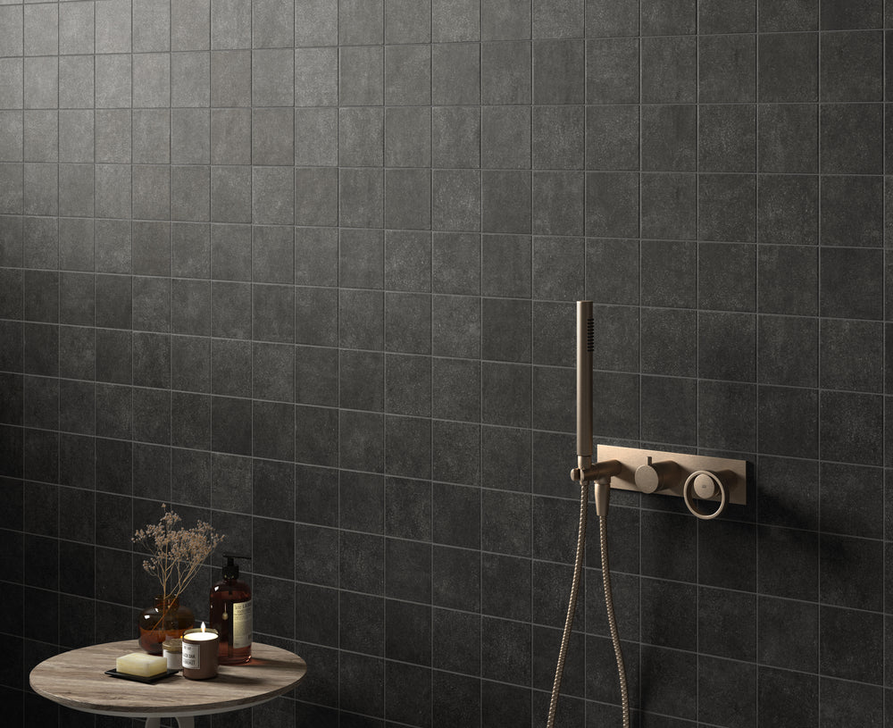 A bold and modern tone that adds depth and contrast, highlighted by Stage Charcoal 4X4 Matte Porcelain.