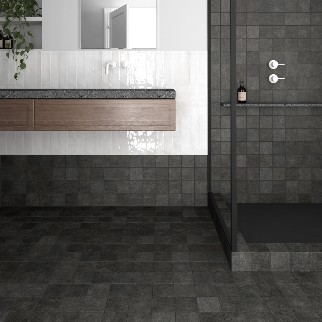 A refined, industrial-inspired look using Stage Charcoal 4X4 Matte Porcelain, adding a touch of modern sophistication to spaces.