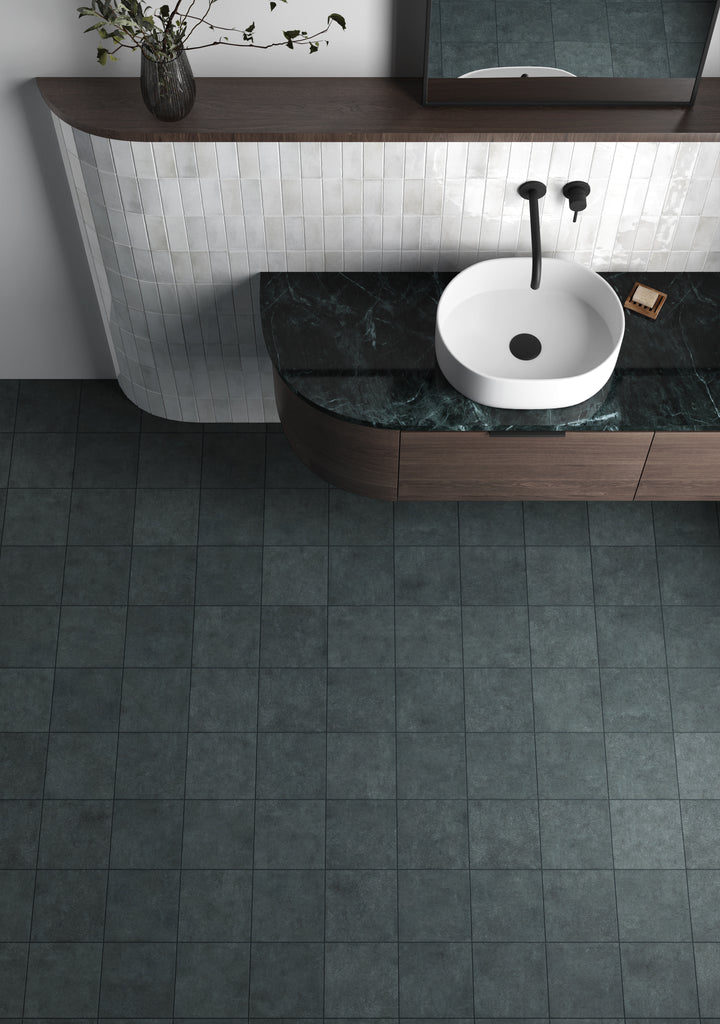 A deep denim blue with a matte finish, Stage Denim 4x4 porcelain tile adds a rich and modern touch to any space.