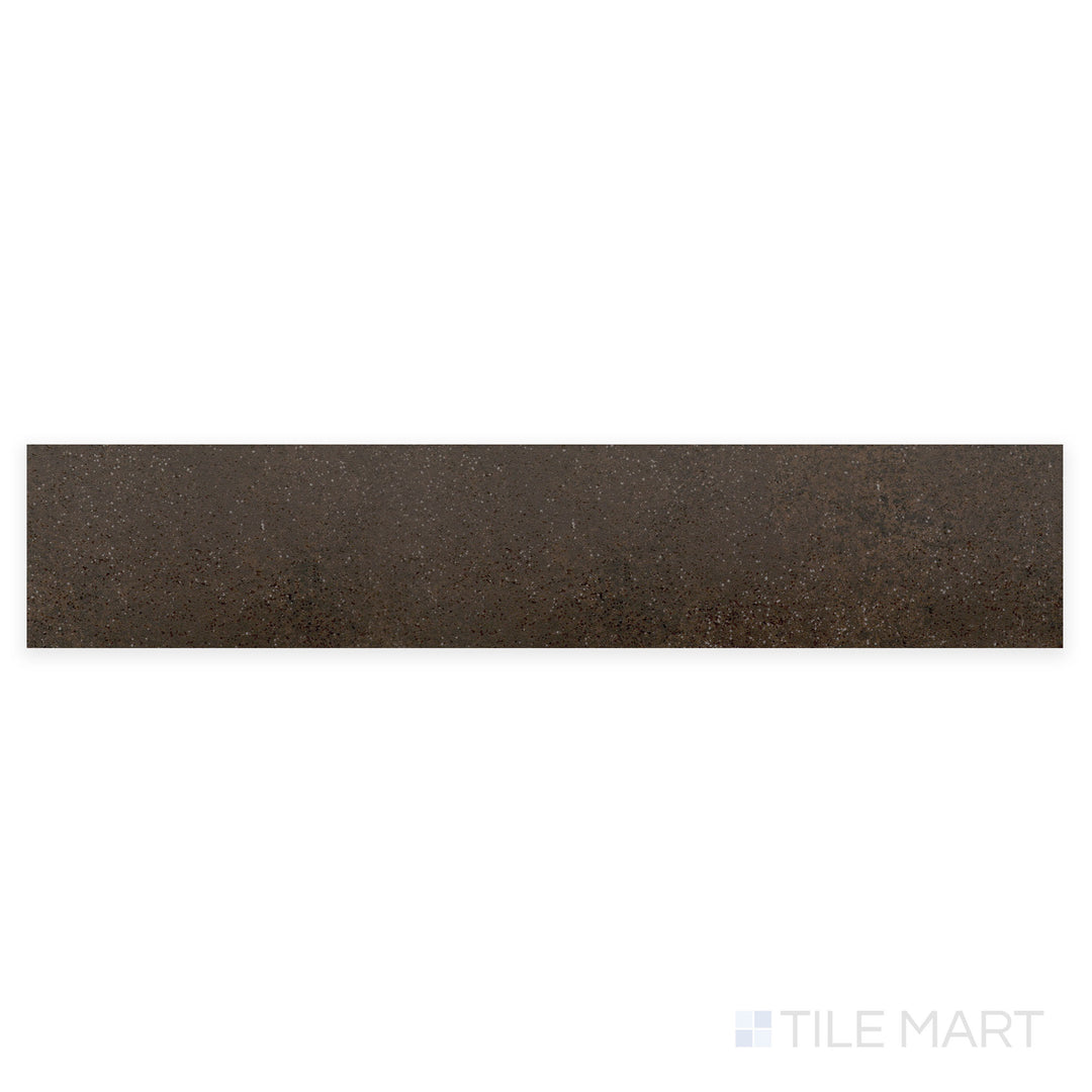 A detailed macro shot of Stage Brown 2.5X12 matte porcelain tile reveals its deep brown shade and refined matte texture, perfect for warm, rustic interiors.
