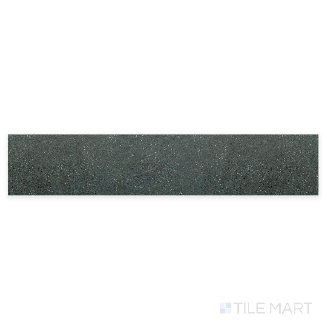 A finely detailed close-up of Stage Denim 2.5X12 matte porcelain tile highlights its rich denim blue color with a soft matte surface, bringing a subtle yet stylish touch.