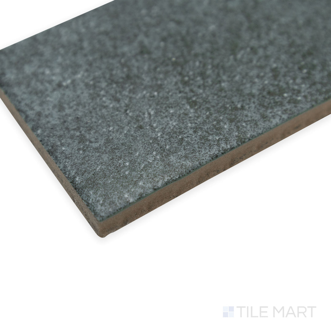 Corner shot of Stage Denim 2.5x12 matte porcelain tile, capturing its subtle blue color, velvety matte finish, and precisely aligned corner detail.