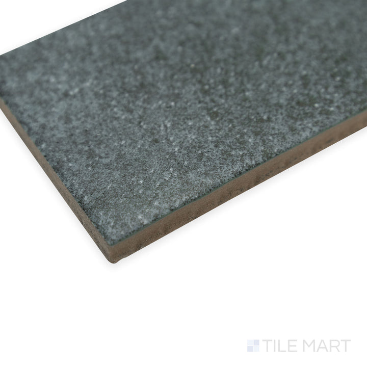 Corner shot of Stage Denim 2.5x12 matte porcelain tile, capturing its subtle blue color, velvety matte finish, and precisely aligned corner detail.