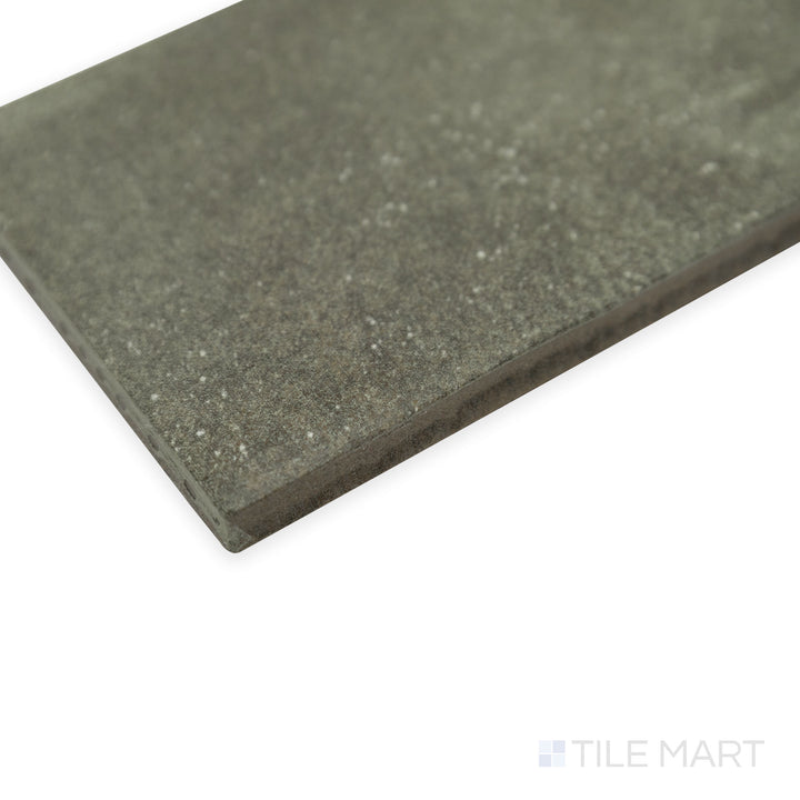 Corner shot of Stage Denim 2.5x12 matte porcelain tile, capturing its subtle blue color, velvety matte finish, and precisely aligned corner detail.