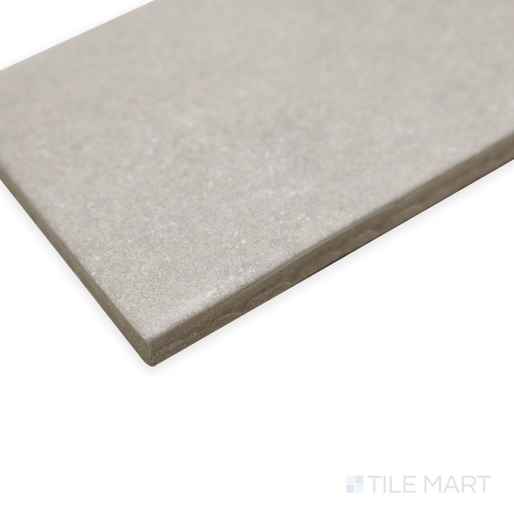 Angled view of Stage Grey 2.5x12 matte porcelain tile, showcasing its versatile neutral hue, refined matte surface, and sharp edge detailing.
