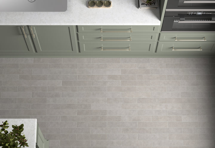 A refined and neutral tone that pairs well with various styles, featuring Stage Grey 2.5X12 Matte Porcelain.