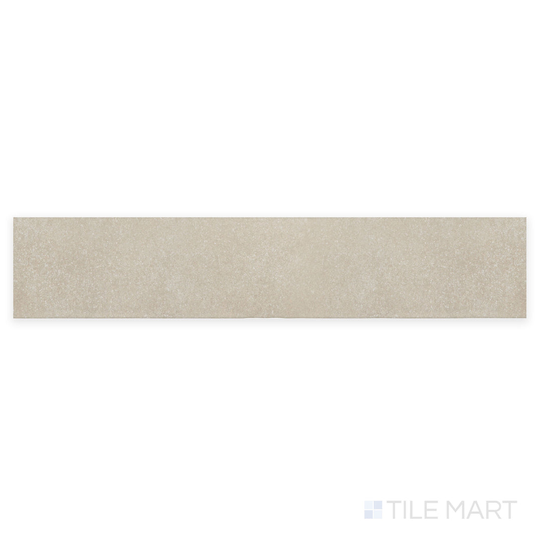 A close-up perspective of Stage Taupe 2.5X12 matte porcelain tile showcases its warm taupe shade and refined matte surface, blending seamlessly with neutral interiors.
