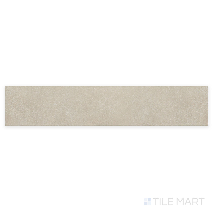 A close-up perspective of Stage Taupe 2.5X12 matte porcelain tile showcases its warm taupe shade and refined matte surface, blending seamlessly with neutral interiors.
