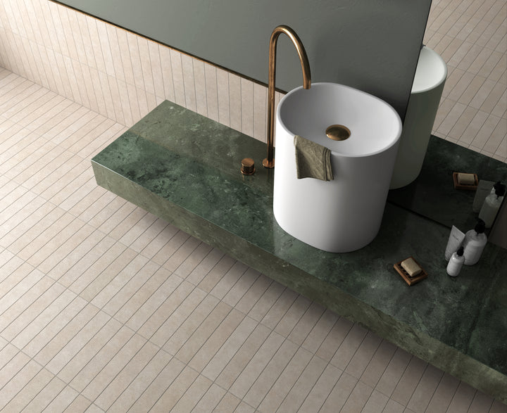 A soft and sophisticated shade that enhances any space, highlighted by Stage Taupe 2.5X12 Matte Porcelain.