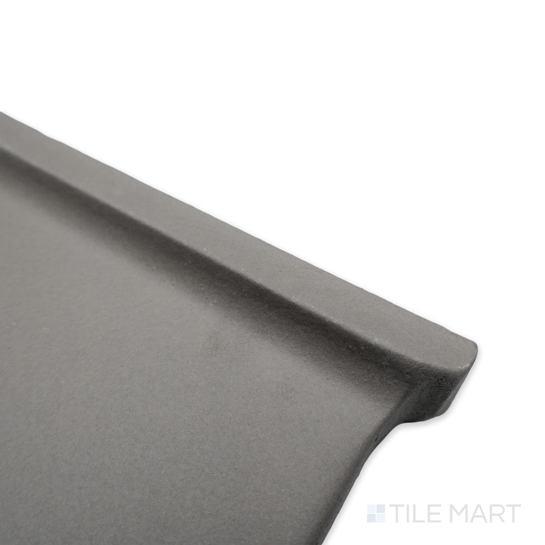 Corner shot of Quarry + Gray 6x6 matte ceramic outside corner right, featuring a neutral grey shade with clean-cut edges and a smooth matte texture.