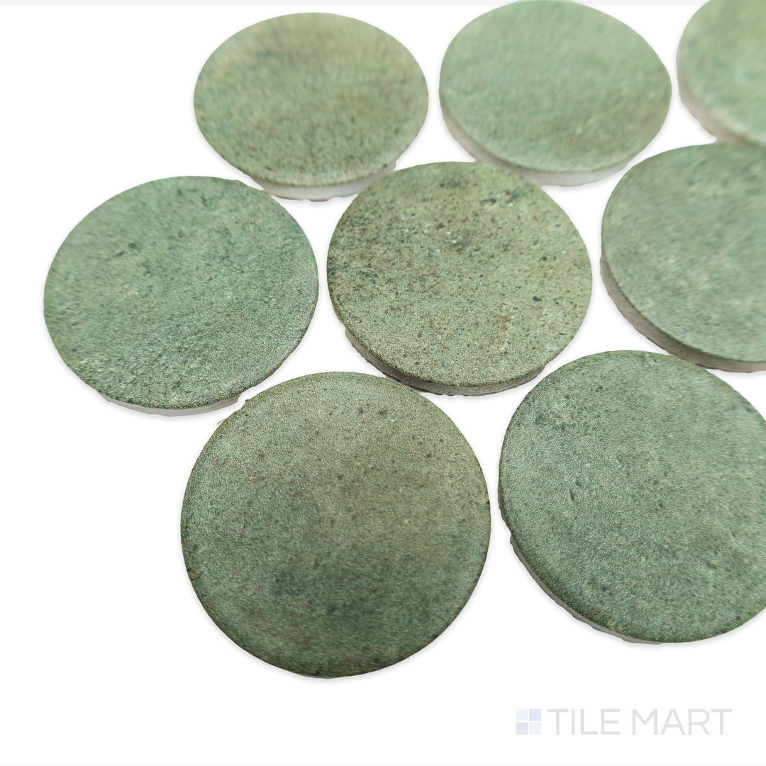 Corner shot of Stage Forest 2" penny round matte porcelain mosaic tile, highlighting its dark green hues, textured finish, and slight dimensional spacing.