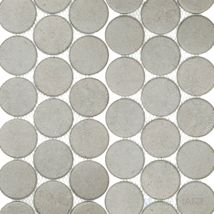 Top-down view of Stage Grey 2" penny round matte porcelain mosaic tiles, displaying a balanced gray hue and subtle surface texture.