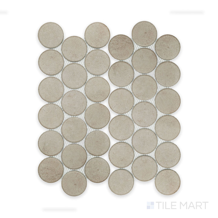 Top-down view of Stage Taupe 2" penny round matte porcelain mosaic sheet, featuring a soft, warm taupe palette and a regular penny round configuration.