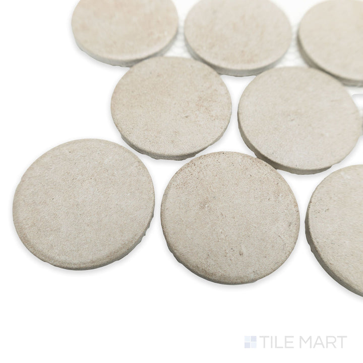 Corner perspective of Stage Taupe 2" penny round matte porcelain mosaic tile sheet, showing warm taupe tones and clean edge curvature.