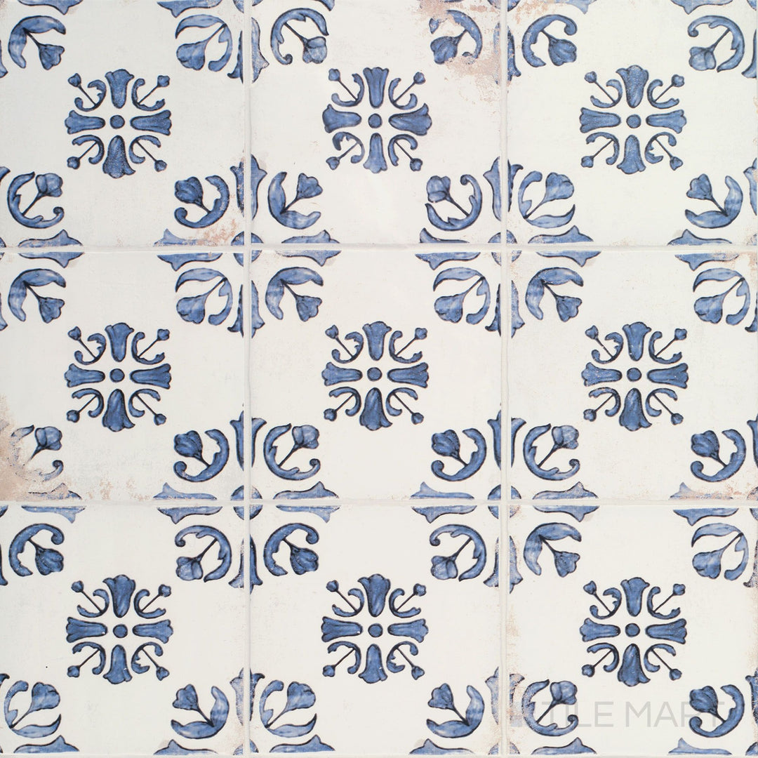 Overview of Fuego Raices Deco 9x9 matte porcelain tile, showcasing decorative detailing and a weathered, artisanal appearance.