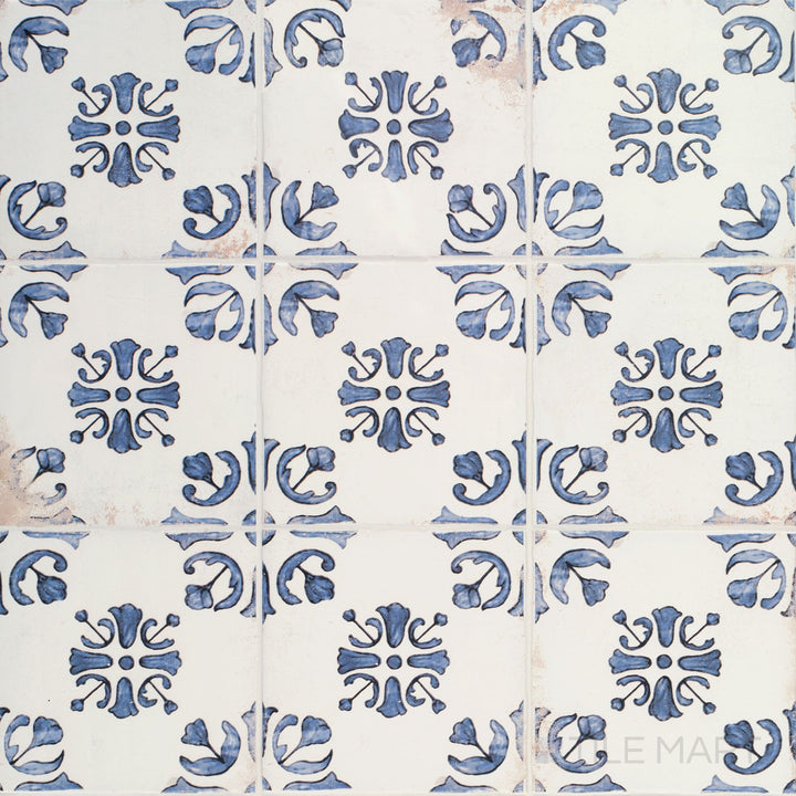 Overview of Fuego Raices Deco 9x9 matte porcelain tile, showcasing decorative detailing and a weathered, artisanal appearance.