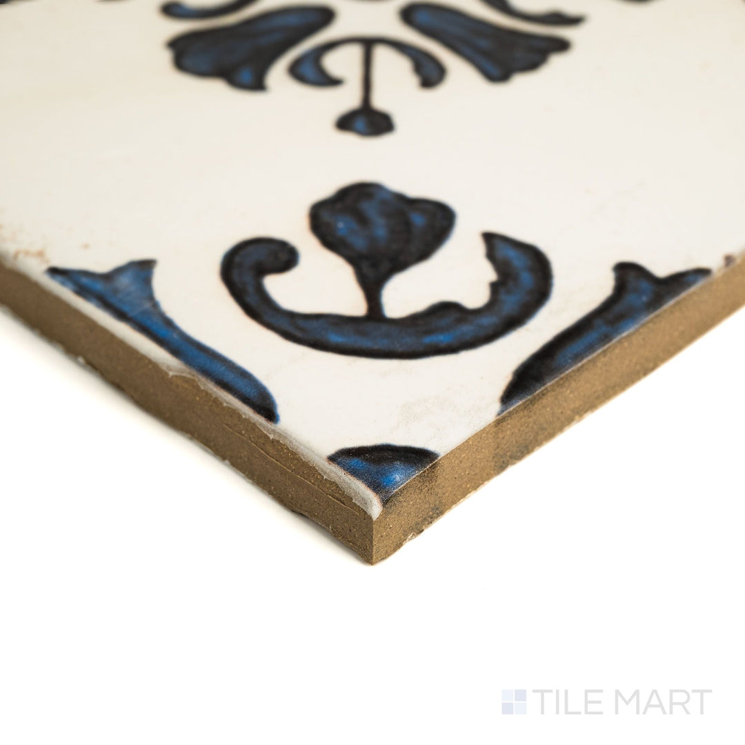 Angled view of Fuego Raices Deco 9x9 matte porcelain tile, showing its decorative pattern, subtle matte texture, and squared tile edge.