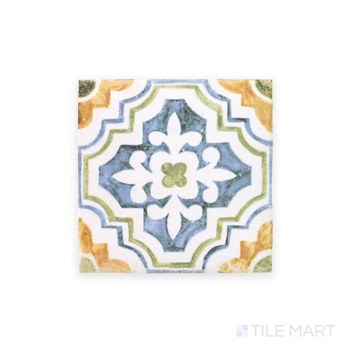 This full tile is viewed from the top, showcasing the artistic patterns and aged finish of the Fuego Huella Deco 9x9 matte porcelain tile.