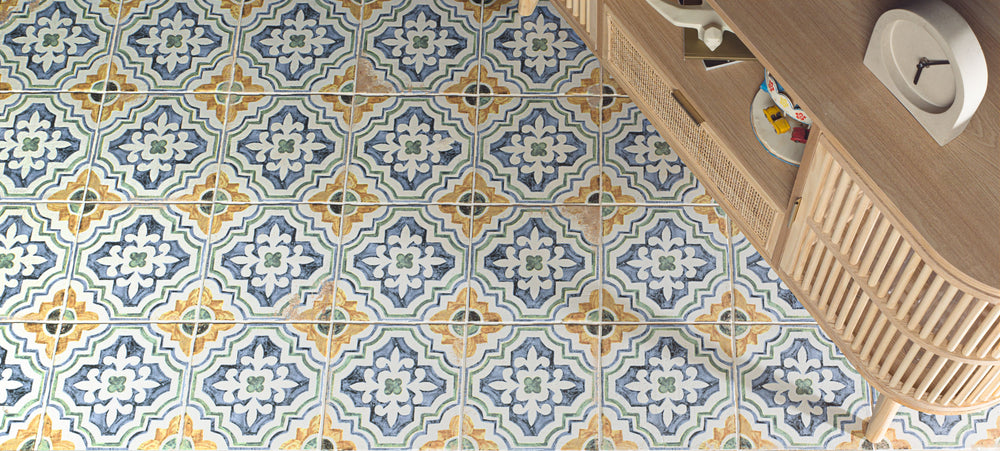 Fuego Huella Deco 9x9 matte porcelain tile shown in a designed space, with intricate surface detail and a rustic matte glaze that enhances visual character.