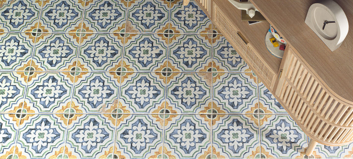 Fuego Huella Deco 9x9 matte porcelain tile shown in a designed space, with intricate surface detail and a rustic matte glaze that enhances visual character.