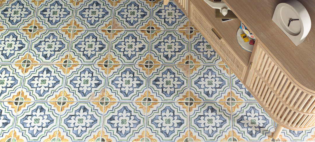 Fuego Huella Deco 9x9 matte porcelain tile shown in a designed space, with intricate surface detail and a rustic matte glaze that enhances visual character.