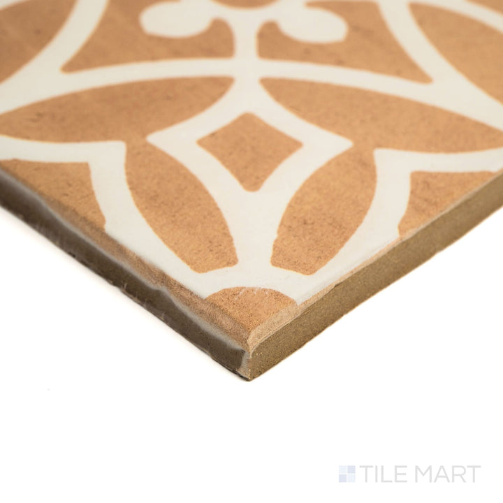 Corner shot of Fuego Era Deco 9x9 matte porcelain tile with a worn-in appearance, textured matte surface, and visible edge depth.