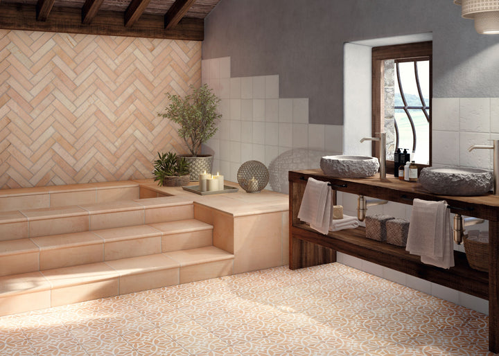 Fuego Era Deco 9x9 matte porcelain tile applied in a built environment, highlighting its antique look, decorative pattern, and softly weathered finish.