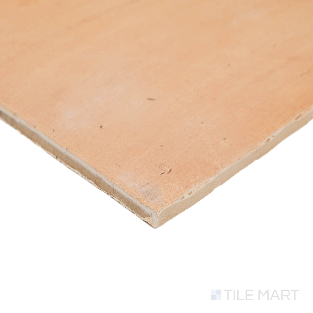 Corner shot of Fuego Natural matte porcelain tile with a worn-in appearance, textured matte surface, and visible edge depth.