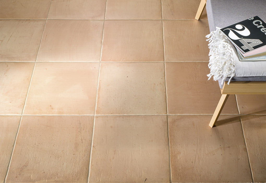 Fuego Natural 9x9 matte porcelain tile installed in a final layout, featuring organic texture and neutral tones for a natural stone-inspired appearance.