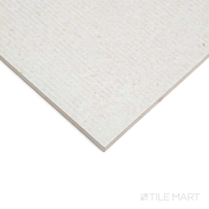 Lime Evolution Ice Deco 24X48 tile appears at an angle, showcasing decorative matte design and clean lines.