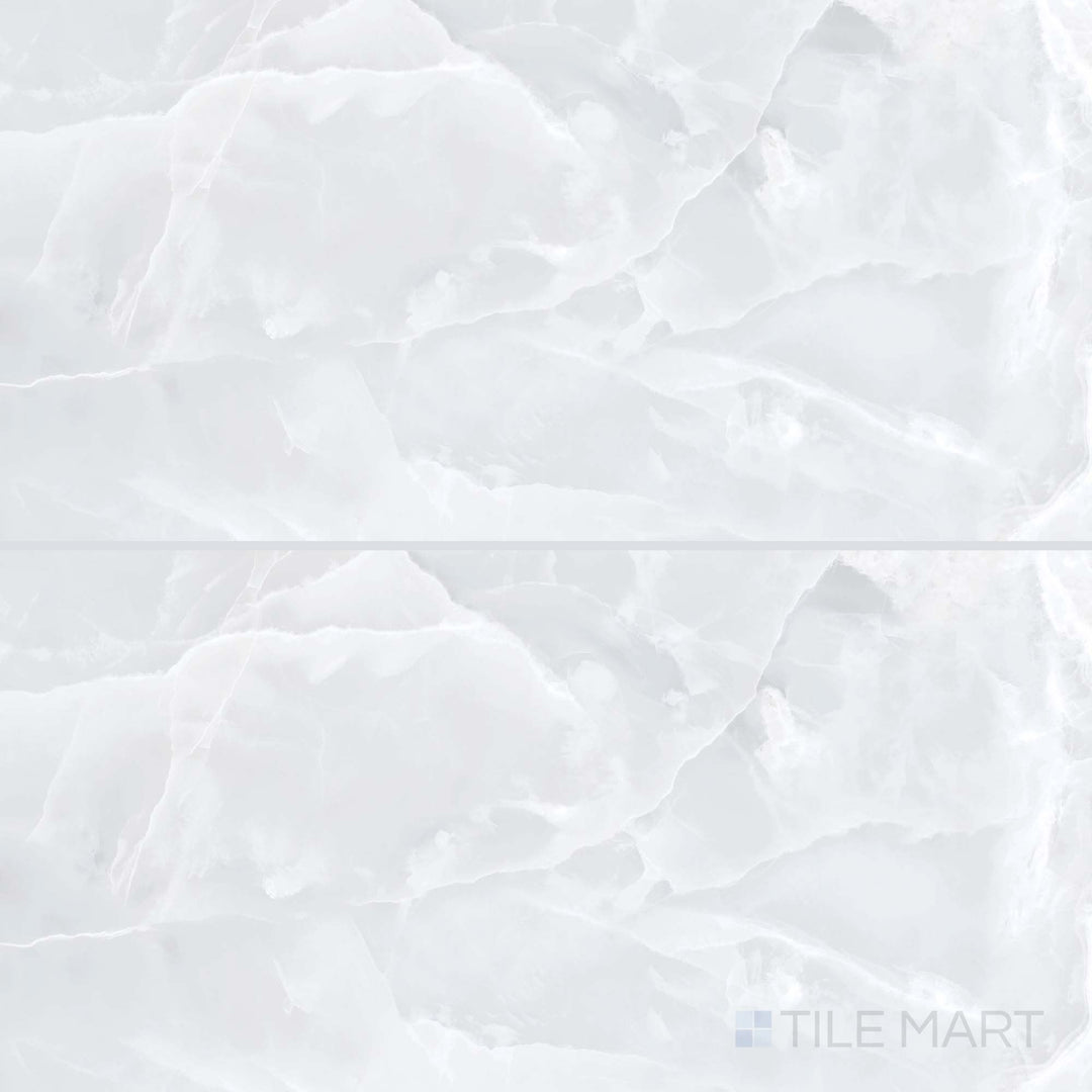 Overview of Soller Onyx Blanco 24x48 polished porcelain tile, highlighting soft veining and reflective white stone aesthetics in a rectangular layout.